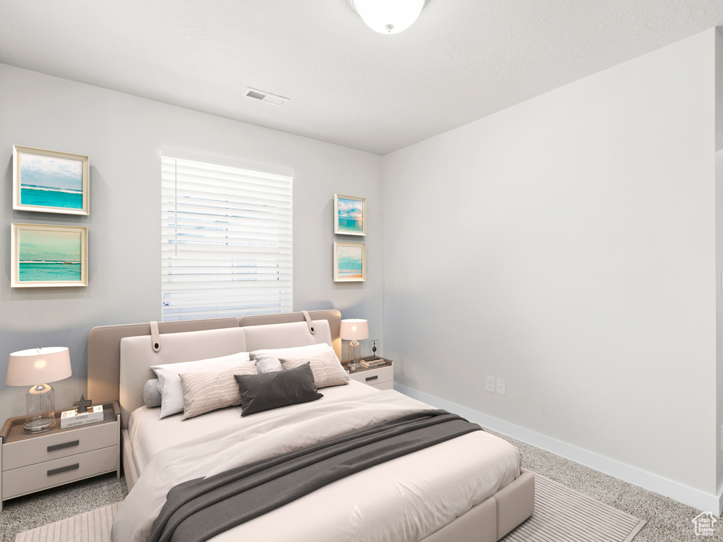 Bedroom with baseboards and carpet