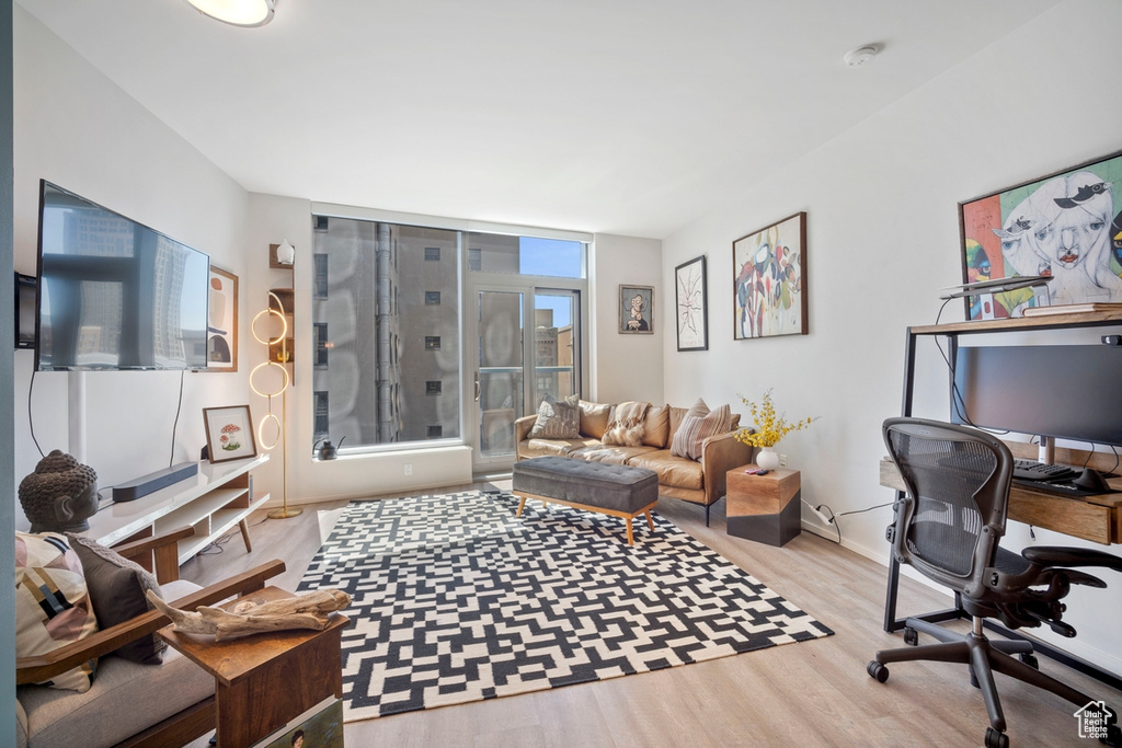 Office area with wood finished floors and baseboards