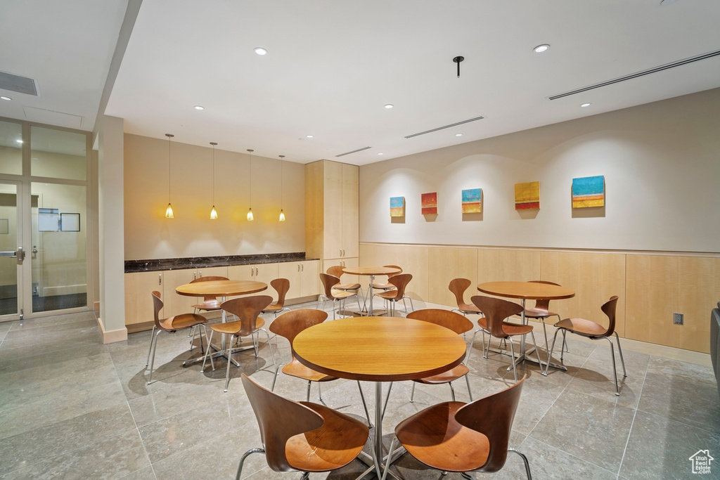 Dining space featuring wainscoting and recessed lighting