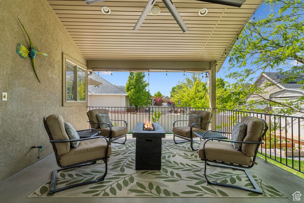 View of patio with a fire pit