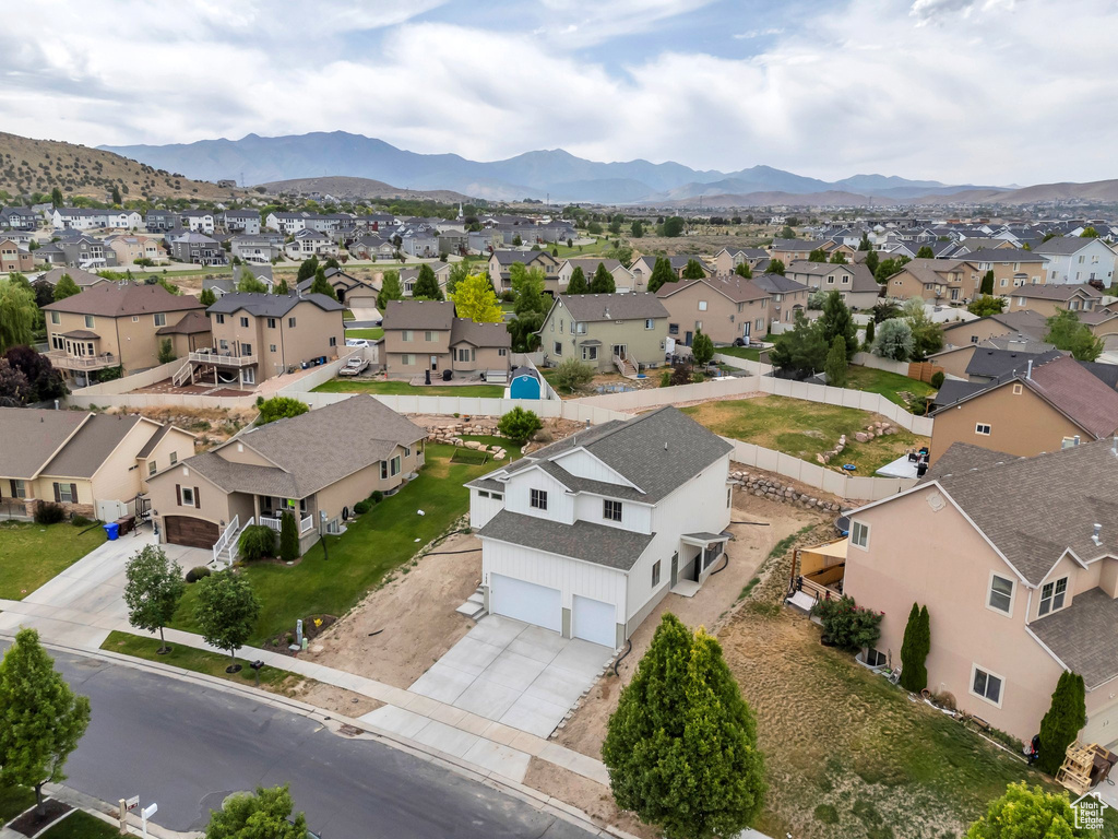 Aerial perspective of suburban area with a mountain backdrop