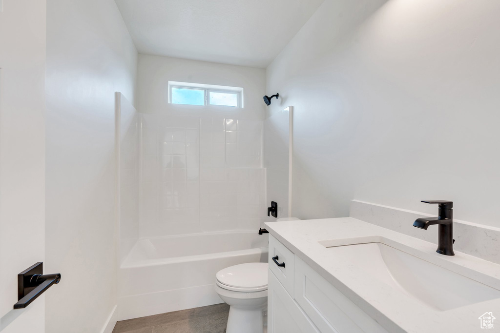 Full bath featuring shower / washtub combination and vanity