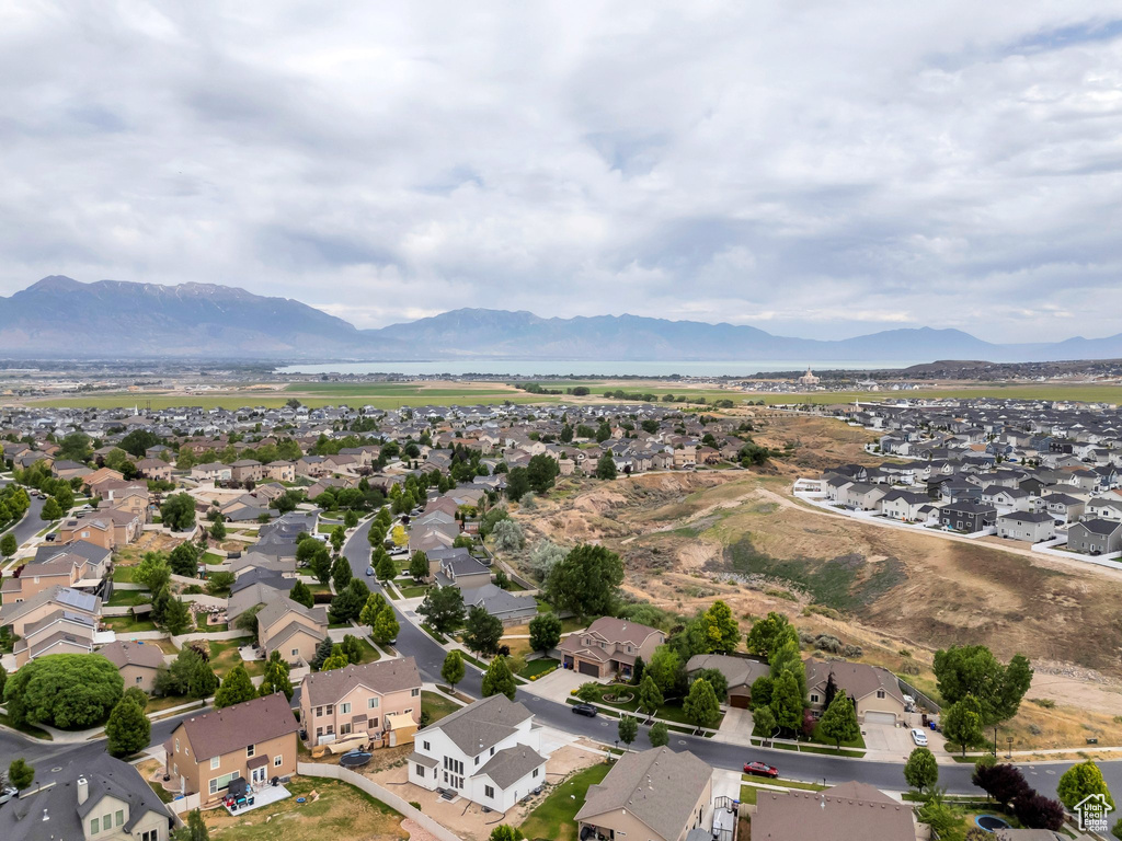 Aerial perspective of suburban area featuring a mountainous background