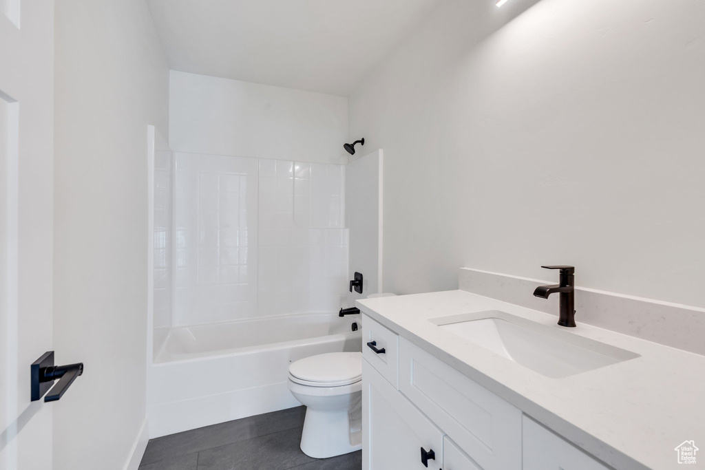 Full bath featuring vanity, shower / bathtub combination, and tile patterned floors