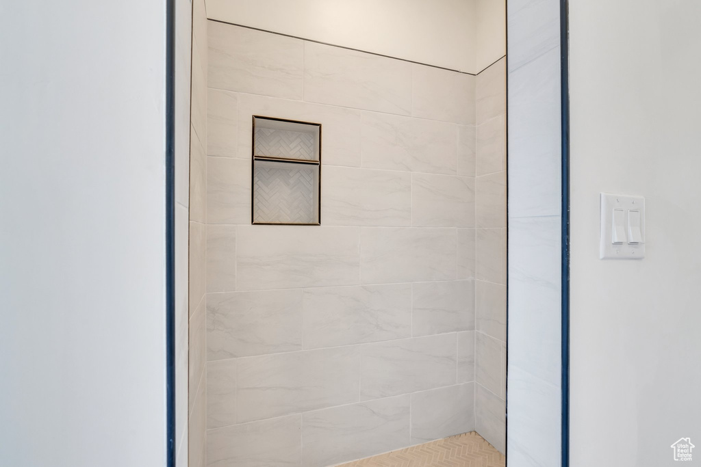 Full bathroom with a tile shower