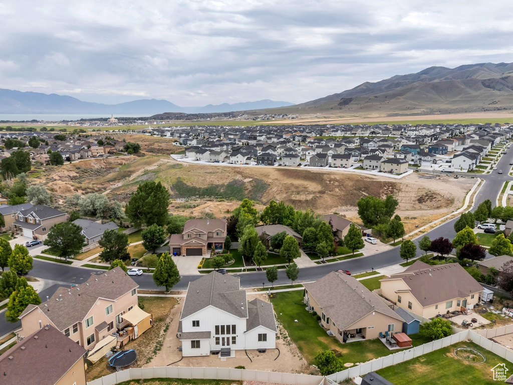 Aerial perspective of suburban area featuring a mountain backdrop