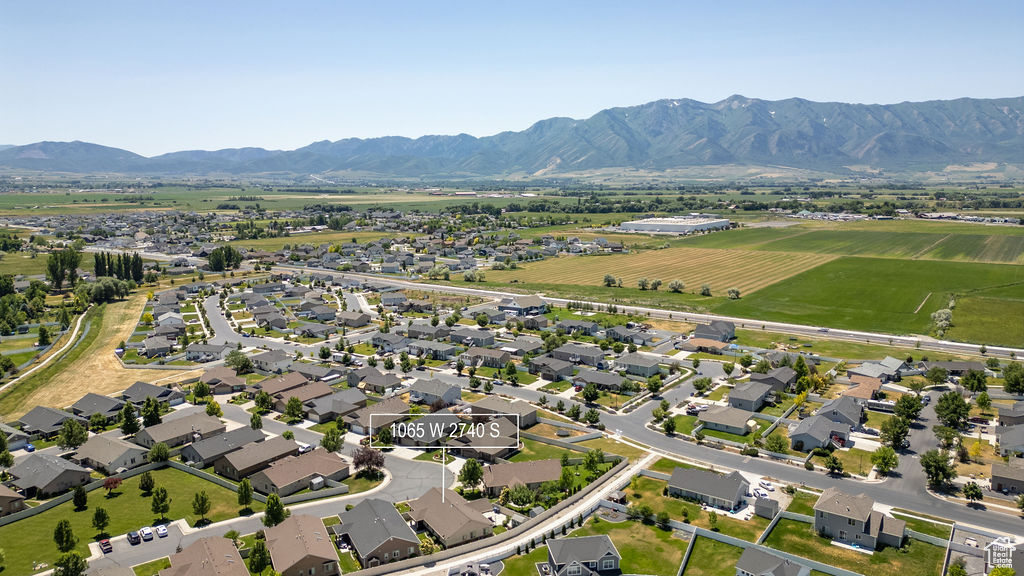 Aerial view of property\'s location featuring nearby suburban area