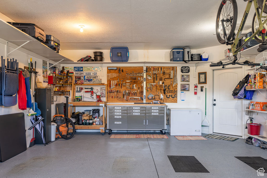 Garage featuring a workshop area