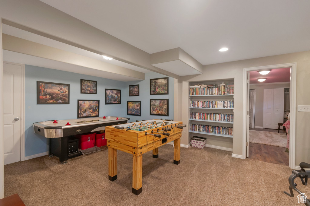 Rec room featuring carpet and baseboards