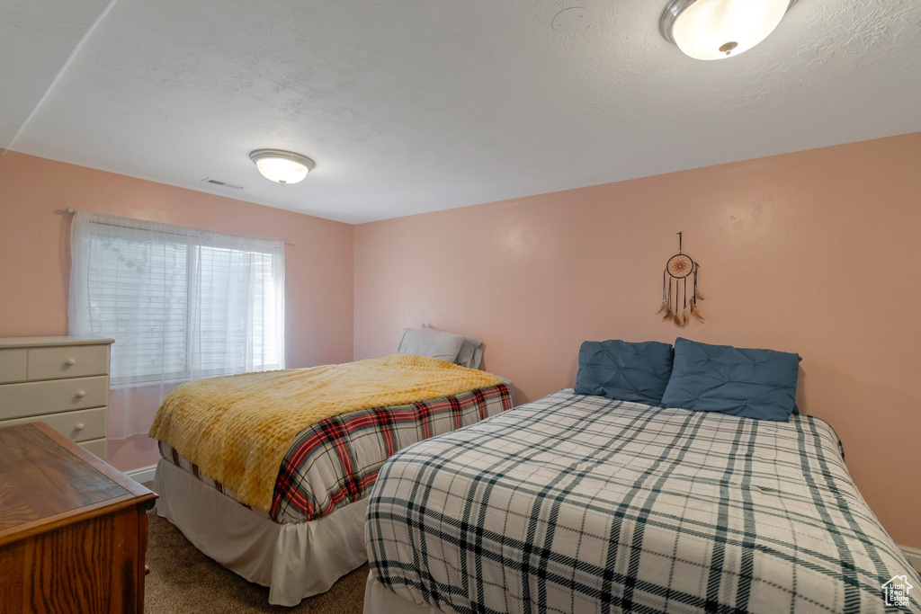 Bedroom featuring carpet