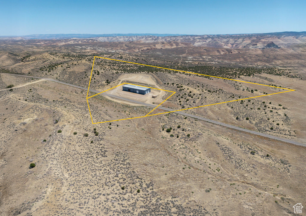 View of rural area featuring property parcel outlined and a mountainous background