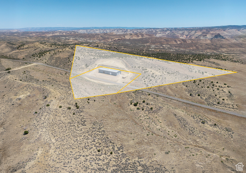 View of rural area with property boundaries highlighted and a mountain backdrop