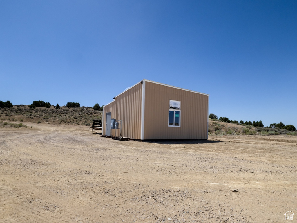View of yard featuring an outbuilding and a view of countryside