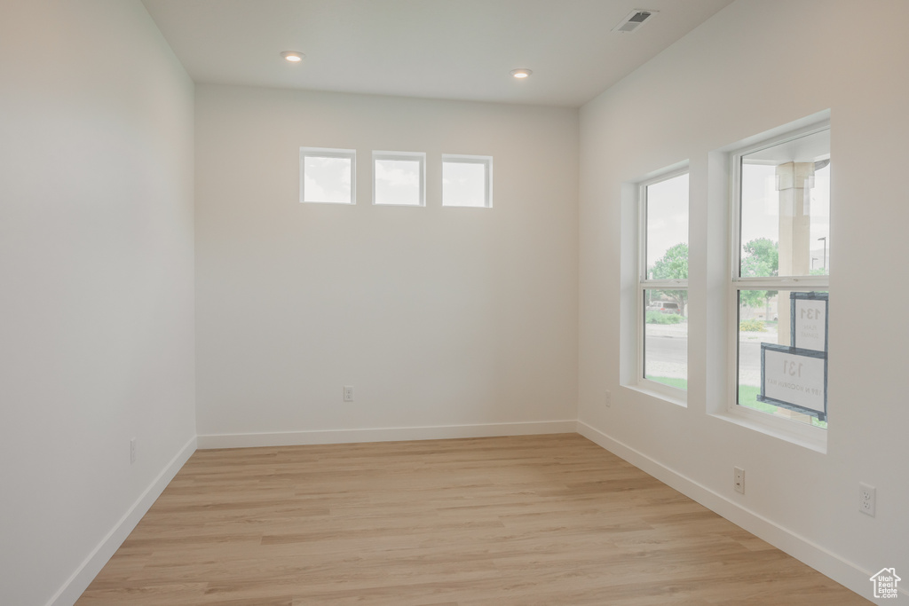 Unfurnished room with light wood finished floors and recessed lighting