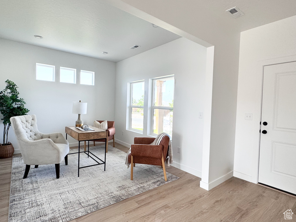 Living area featuring light wood finished floors and plenty of natural light