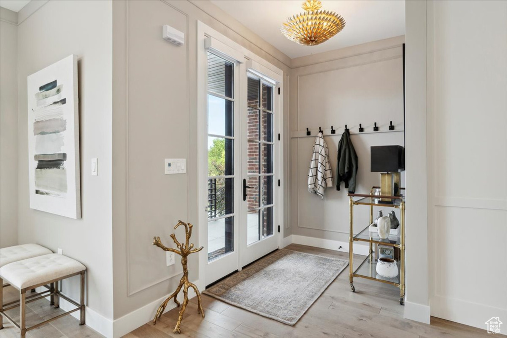 Entryway featuring wood finished floors and baseboards