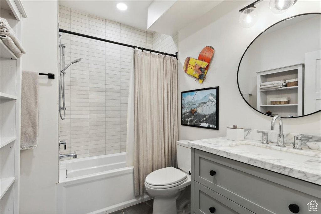 Full bathroom featuring vanity, shower / tub combo, and tile patterned floors