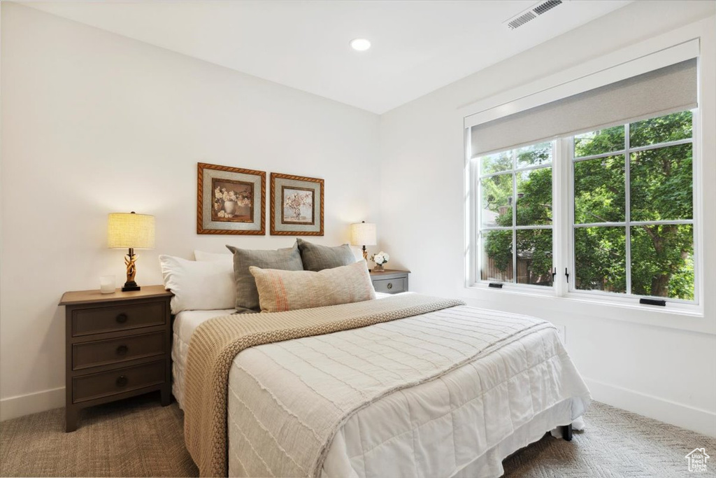 Carpeted bedroom featuring baseboards and recessed lighting