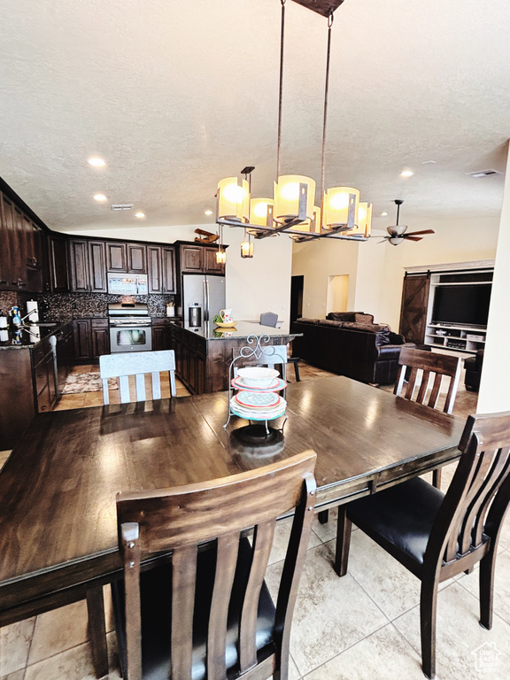 Dining space with a textured ceiling, a ceiling fan, and recessed lighting