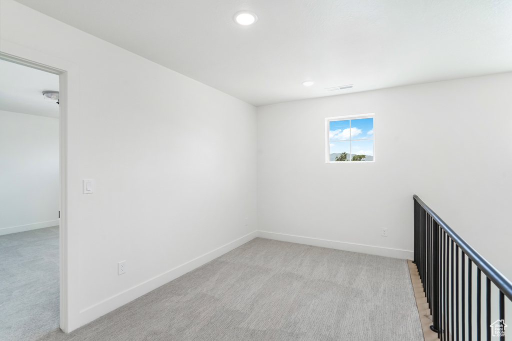Unfurnished room with carpet floors and recessed lighting