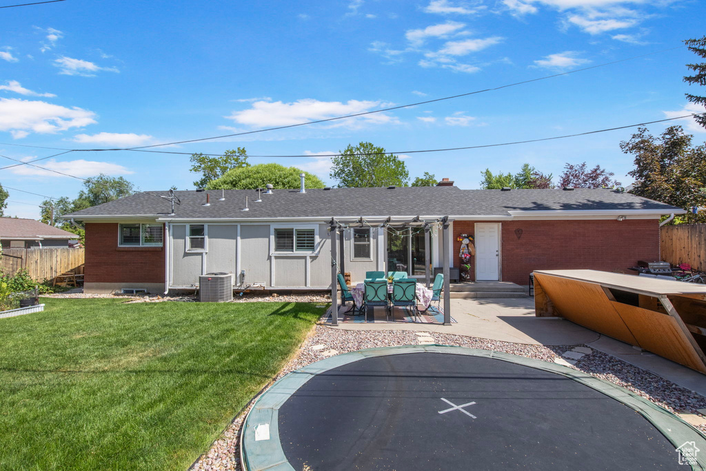Back of house featuring a patio area and brick siding