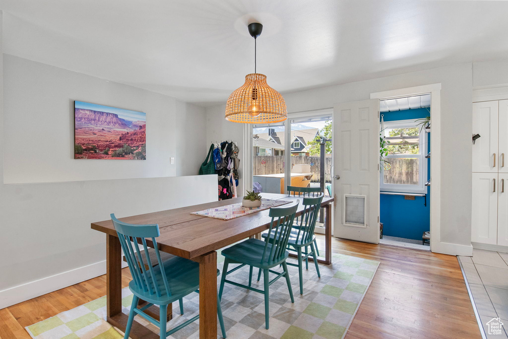 Dining space featuring light wood-type flooring and baseboards