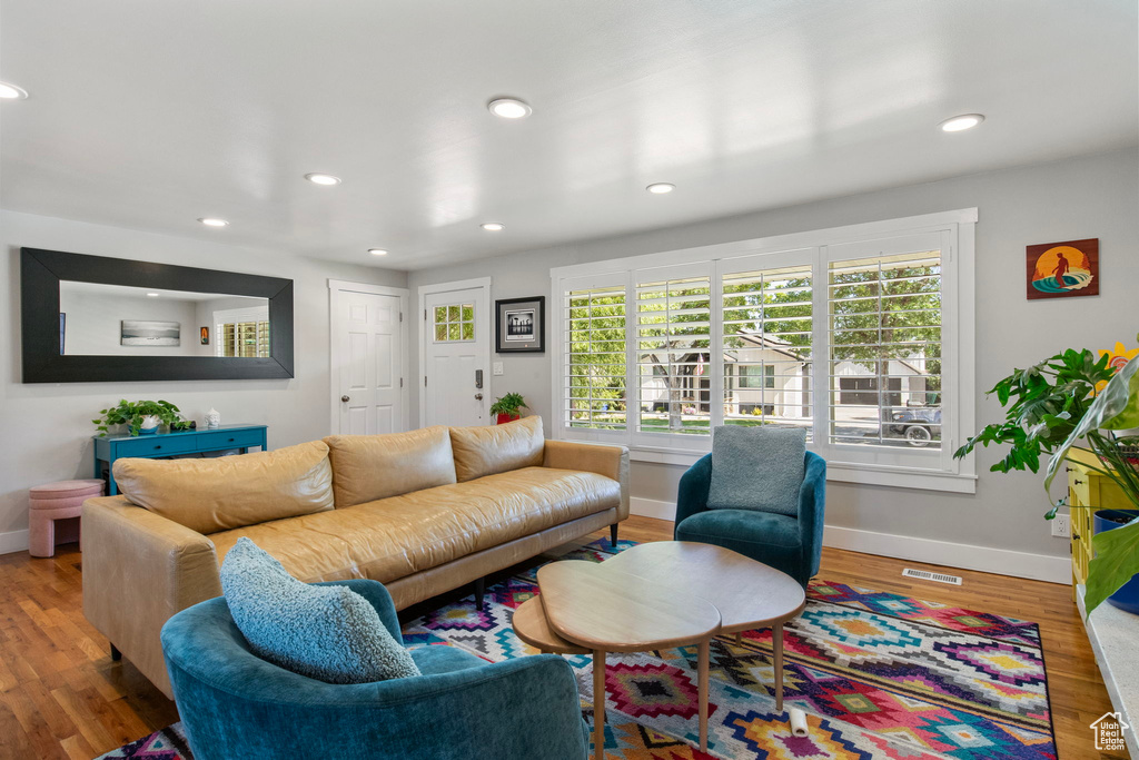 Living area with recessed lighting and wood finished floors