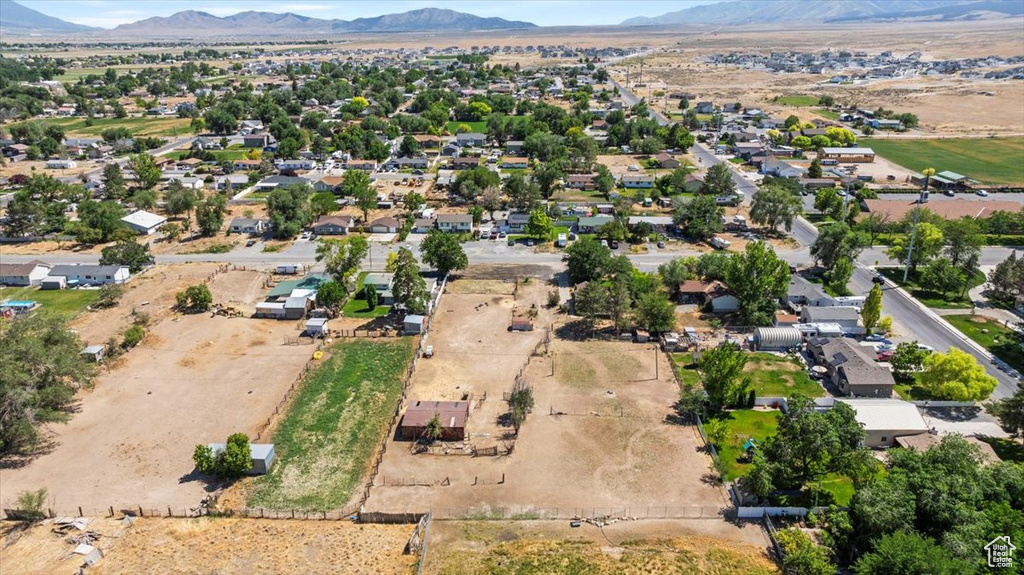 Aerial view of property and surrounding area with mountains