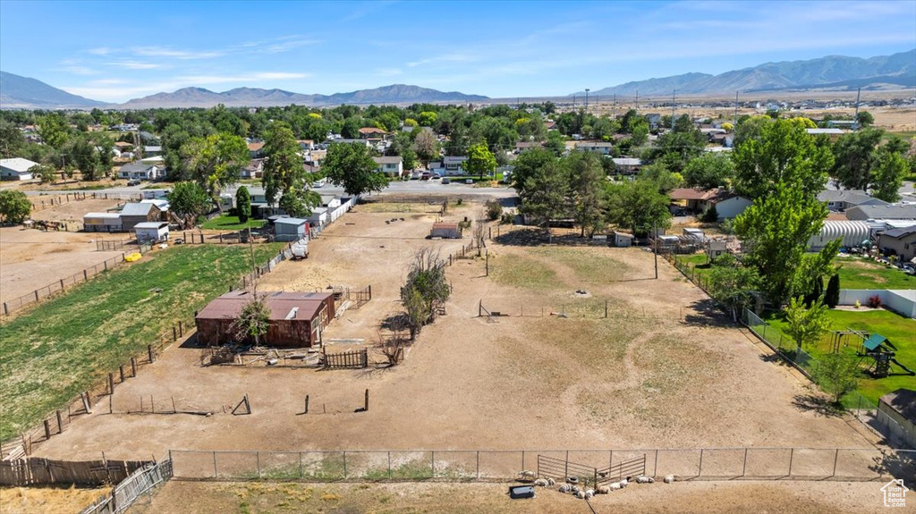 Aerial perspective of suburban area with a mountainous background