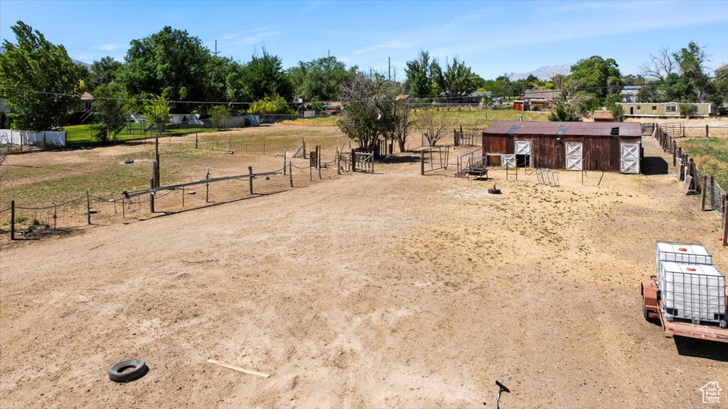 View of yard with an exterior structure, an outdoor structure, and a view of countryside