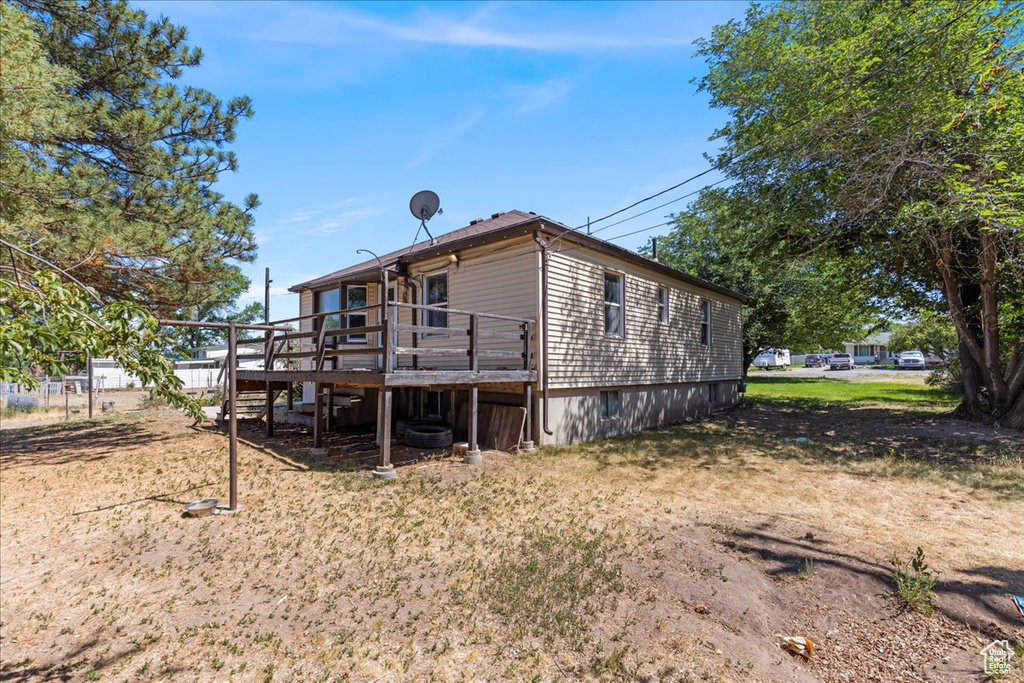 Back of property featuring a deck