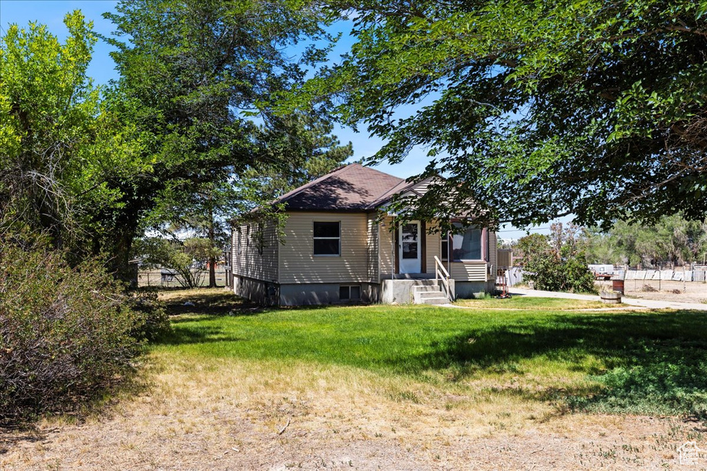 View of front of house with a front lawn