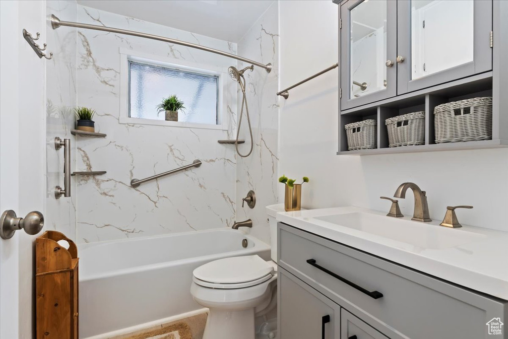 Bathroom with vanity and shower / bath combination