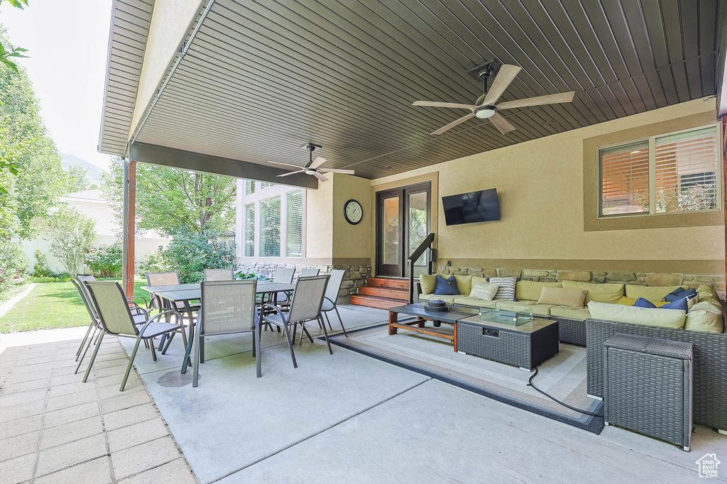 View of patio / terrace featuring entry steps, an outdoor hangout area, a ceiling fan, and outdoor dining area