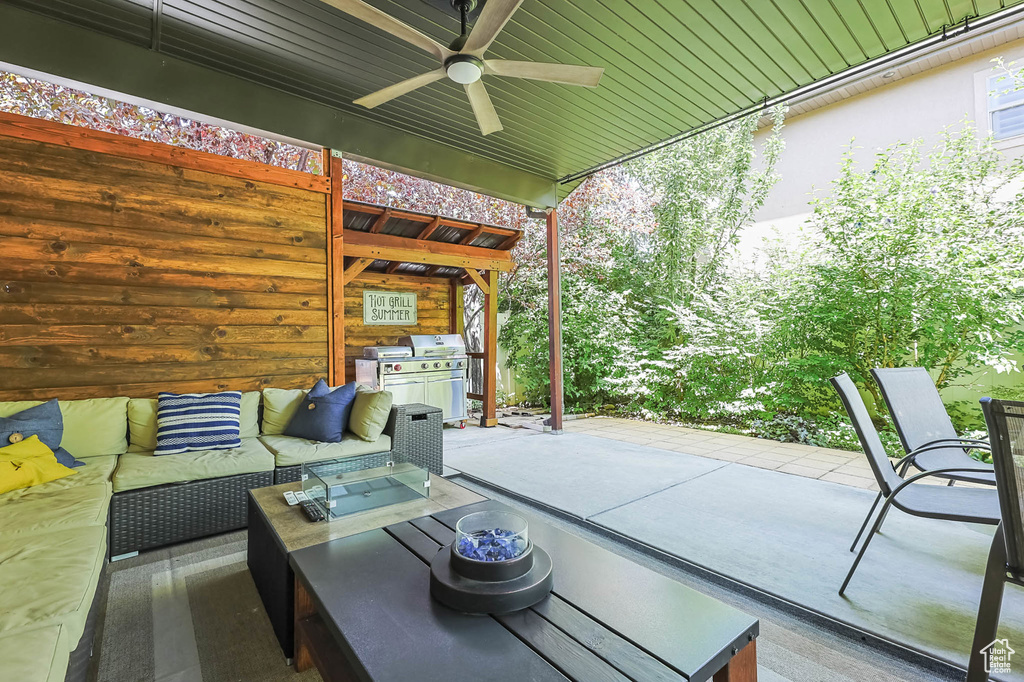 View of patio featuring outdoor lounge area and ceiling fan