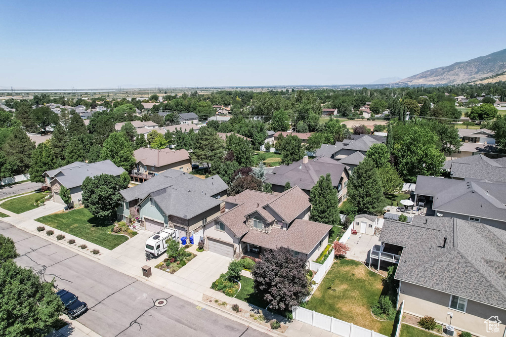 Aerial view of residential area featuring a mountainous background