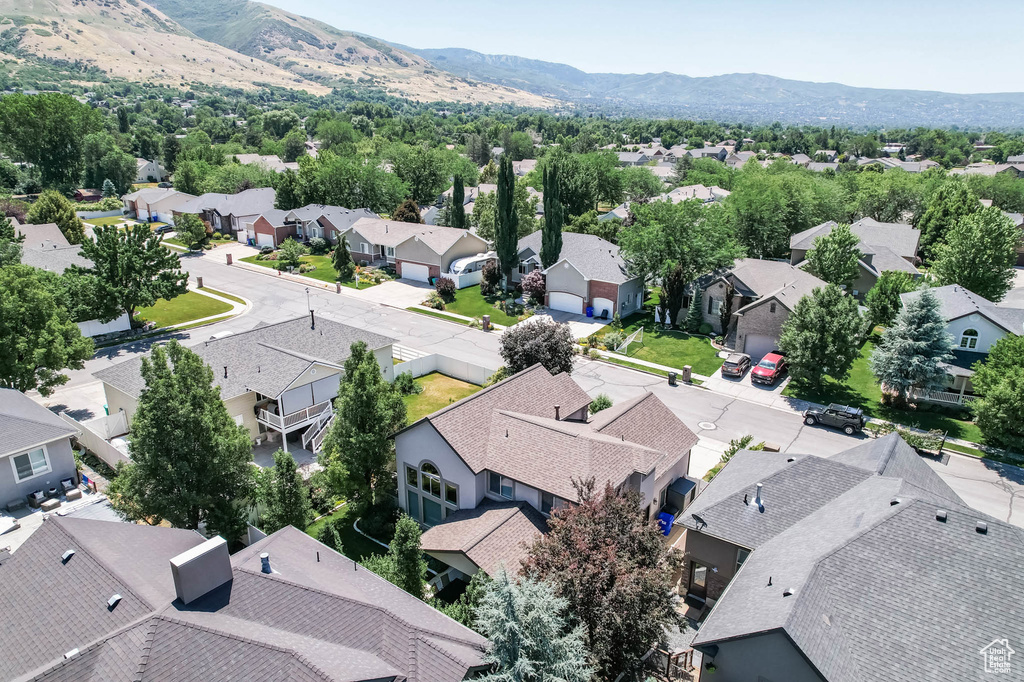 Aerial perspective of suburban area with a mountain backdrop