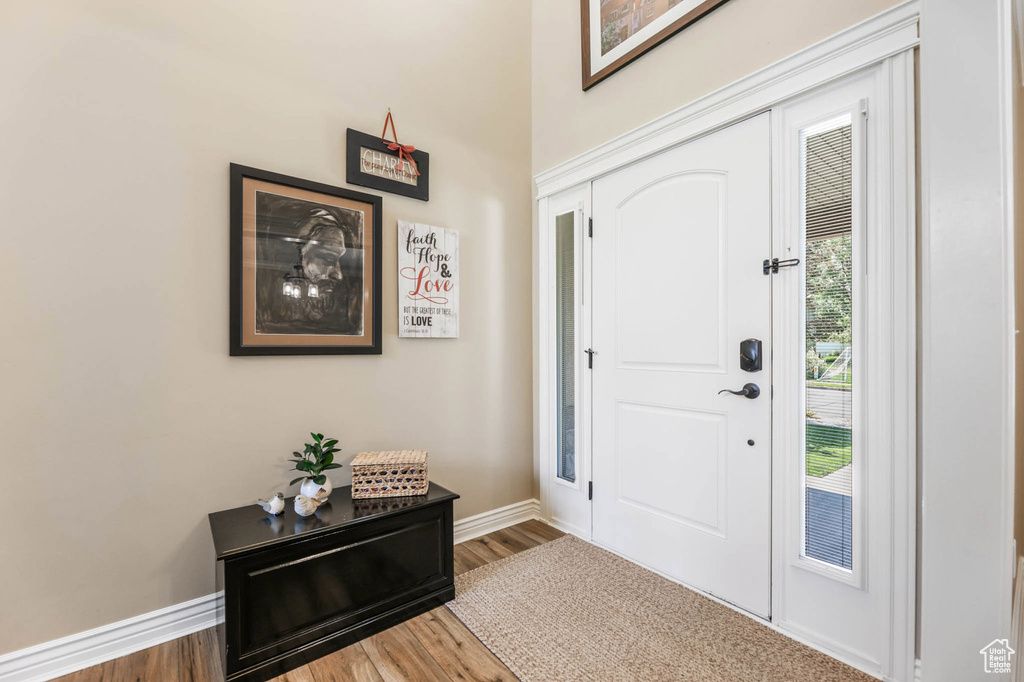 Entrance foyer featuring wood finished floors and baseboards