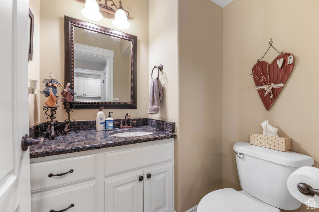 Bathroom with vanity and toilet