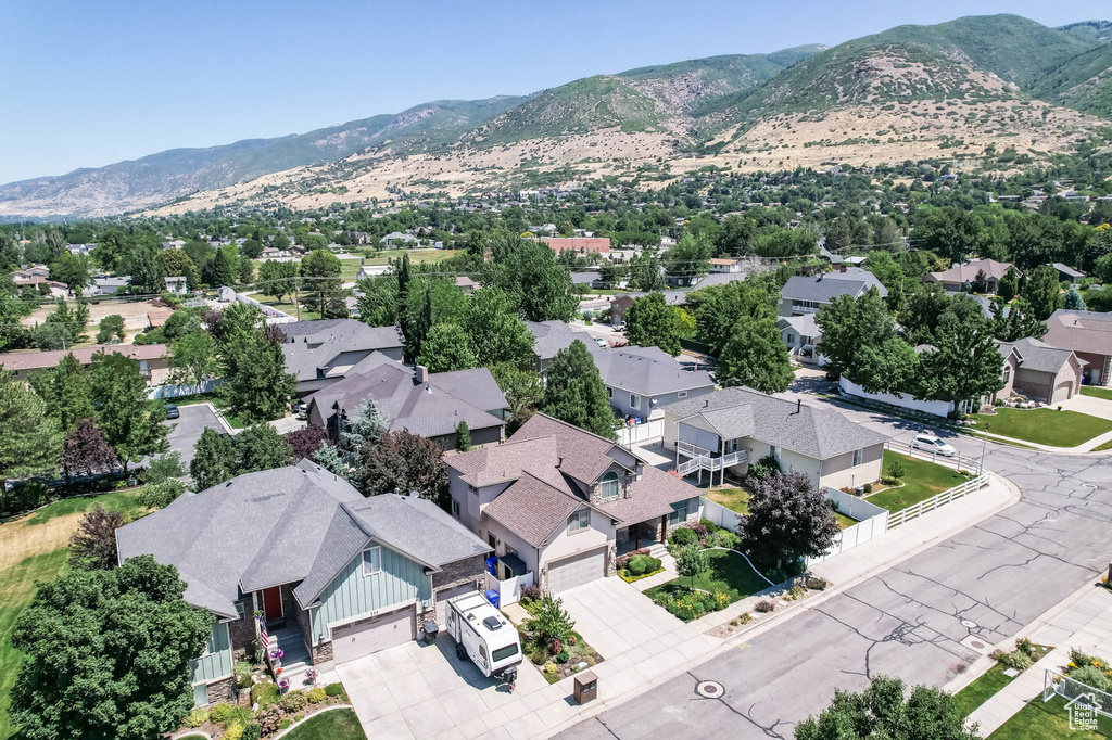 Aerial perspective of suburban area featuring a mountainous background