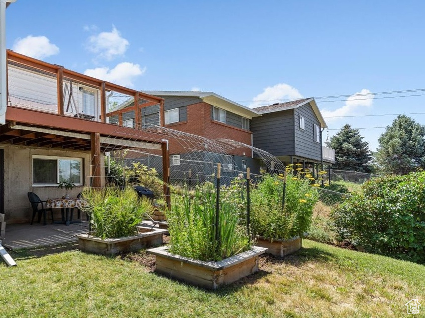 View of yard featuring a wooden deck