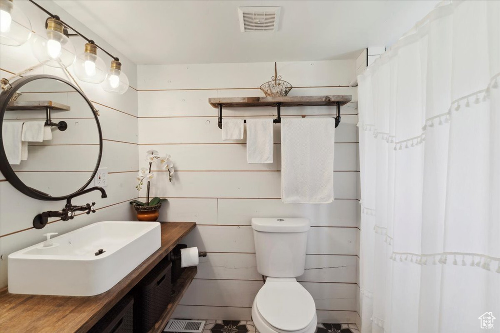 Bathroom featuring vanity and curtained shower