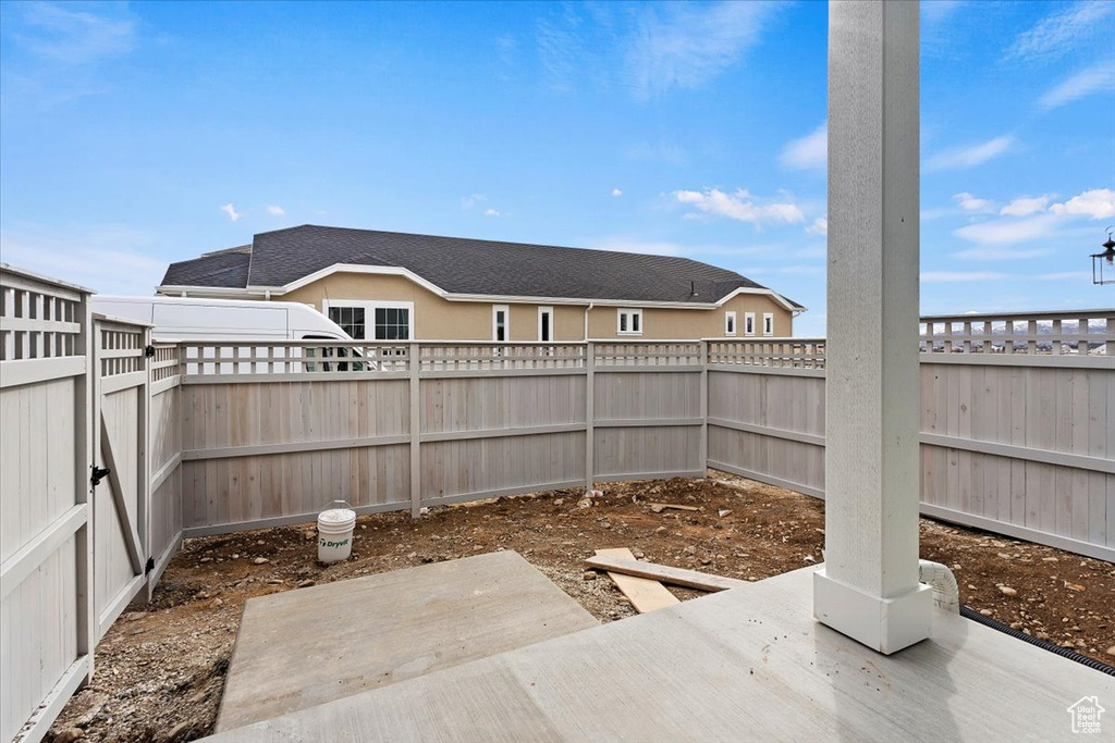 Fenced backyard featuring a patio area