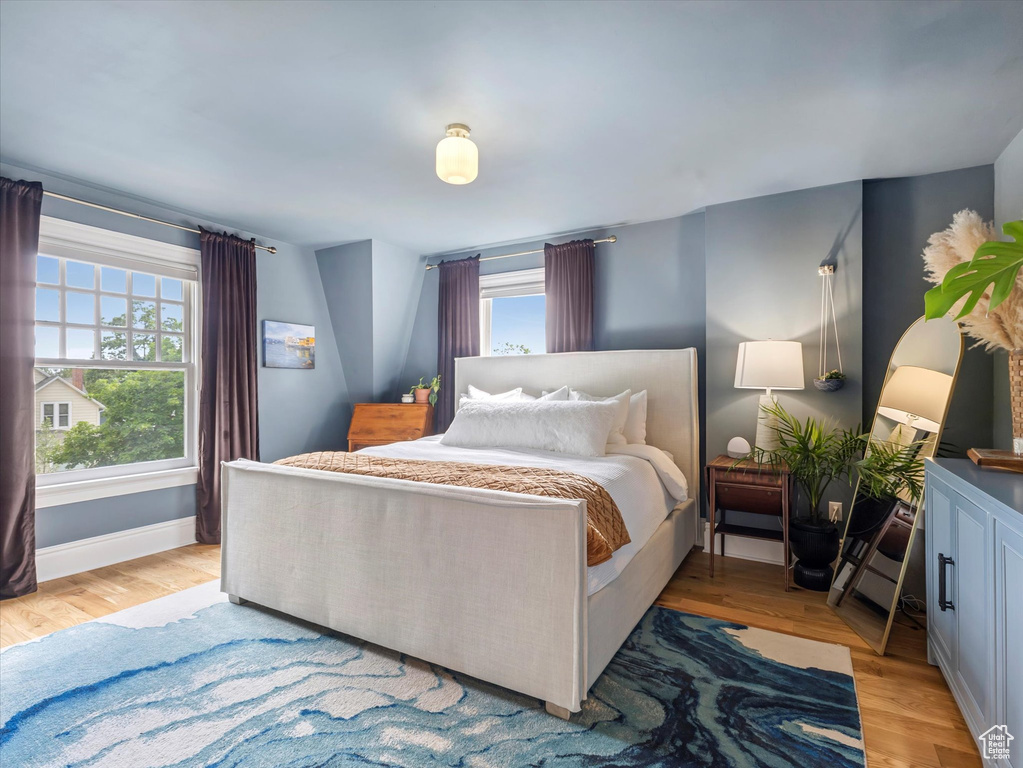 Bedroom featuring light wood-style flooring and baseboards