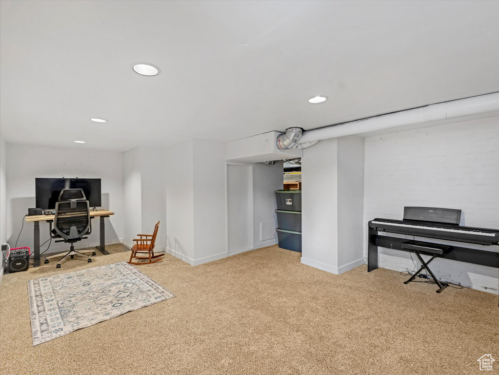 Office area with carpet flooring and recessed lighting
