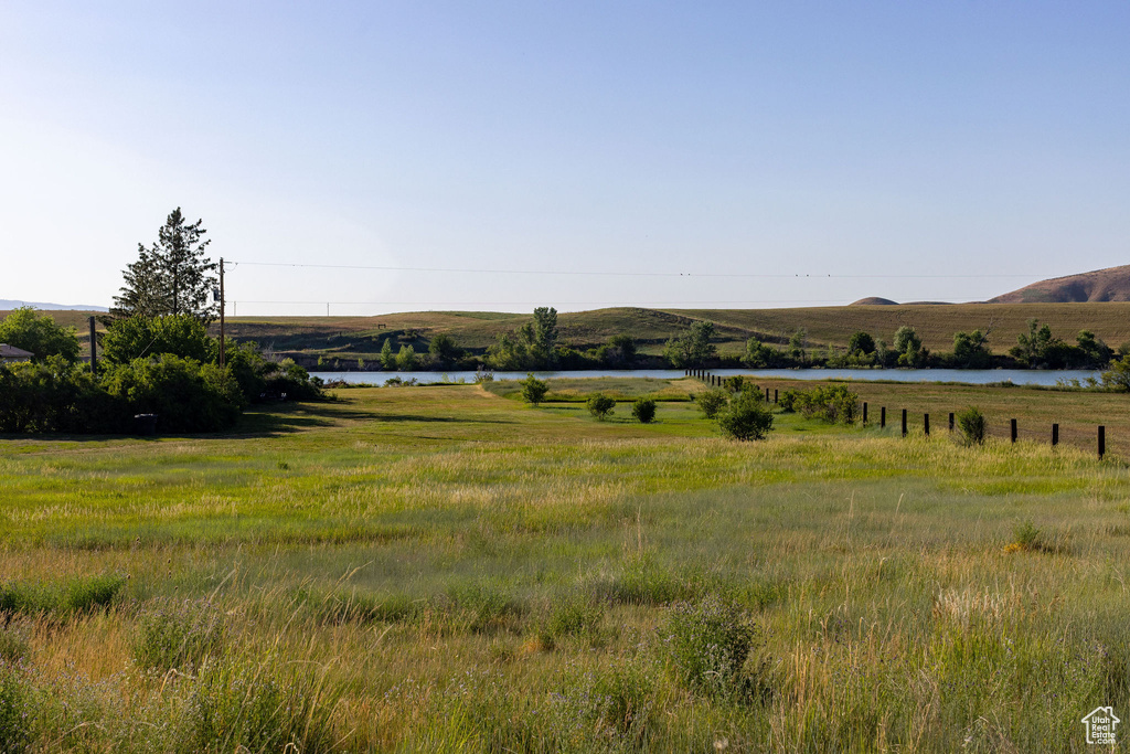 View of mountain backdrop with rural landscape