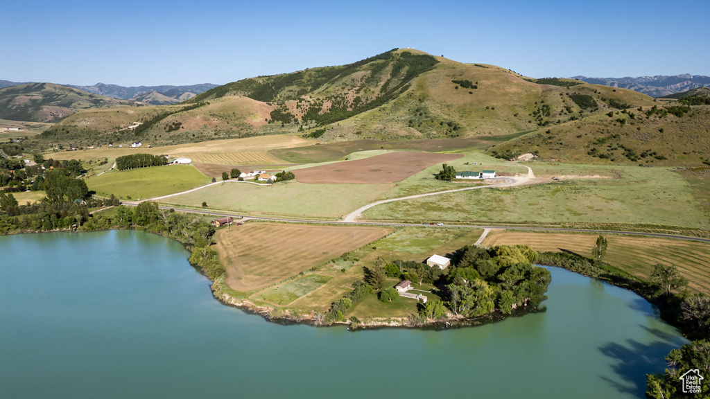Aerial overview of property's location with a water and mountain view and rural landscape