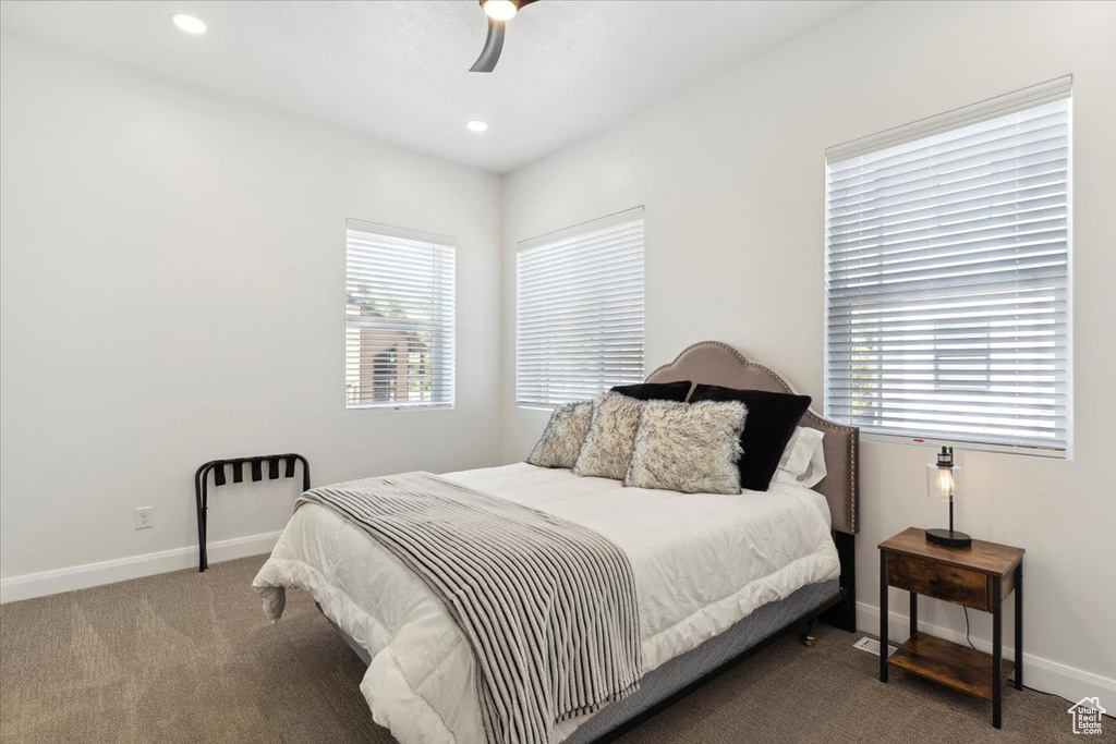 Carpeted bedroom featuring recessed lighting and ceiling fan