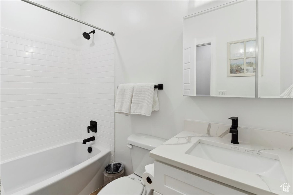 Bathroom with vanity and bathing tub / shower combination