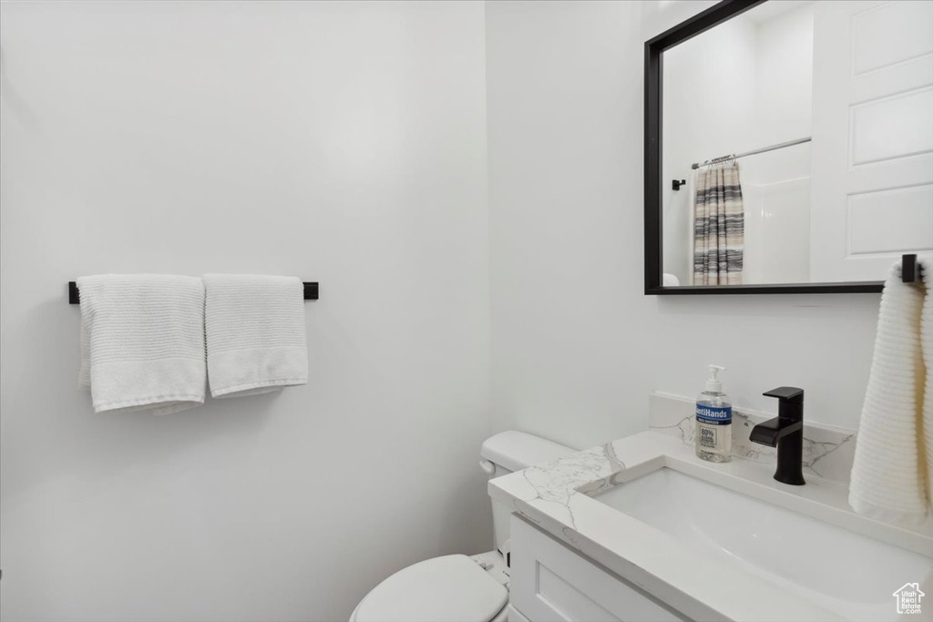 Bathroom with vanity and curtained shower